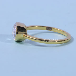 Front standing view of the Bezel Oval Cut East West Moissanite Engagement Ring showing the prong setting