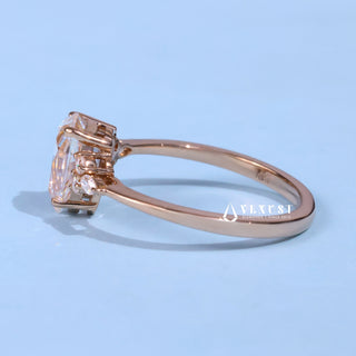 Vintage 1.0ct pear cluster moissanite ring shown on a finger