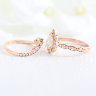 Delicate 1.0ct pear halo moissanite ring side profile view