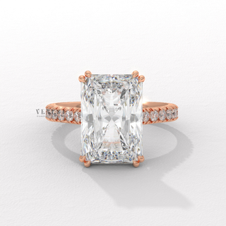 Front view of a radiant cut moissanite engagement ring with a pave band up close