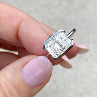 Sparkling 1.91ct emerald solitaire moissanite ring angled view showing its sparkle