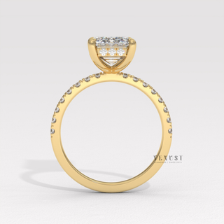 Front view of a emerald cut moissanite engagement ring with a hidden halo and pave band from the right