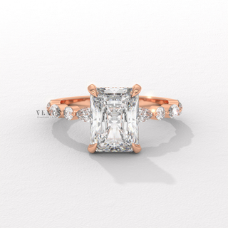 Front view of a round cut moissanite engagement ring with a hidden halo and pave band up close