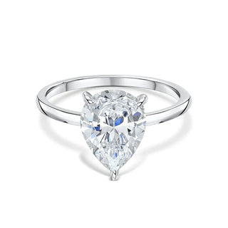Bold 1.33ct pear hidden halo moissanite ring tilted view catching the light