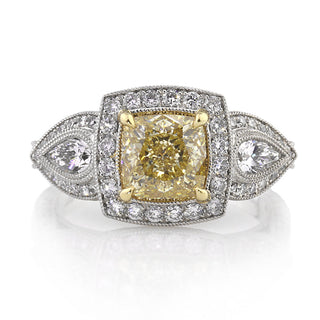 Yellow cushion three stone moissanite engagement ring front view