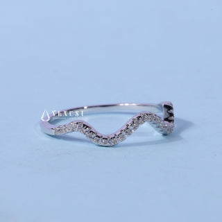 Elegant round moissanite wedding band angled view showing its sparkle