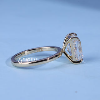Solitaire Radiant Cut Moissanite Engagement Ring resting on its side showing the slim band