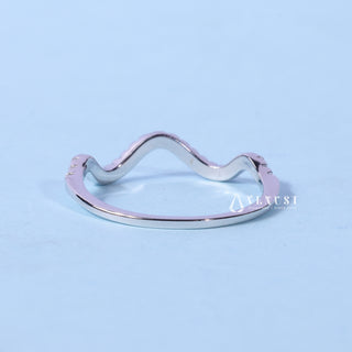 Elegant round moissanite wedding band shown on a finger