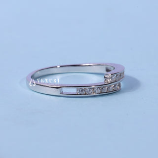 Brilliant round pave moissanite wedding band angled view showing its sparkle