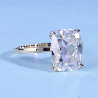 Elongated Cushion Cut Moissanite Engagement Ring resting on its side showing the slim band
