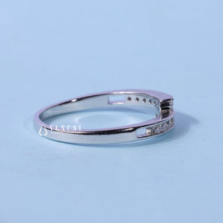 Brilliant round pave moissanite wedding band close up of the setting