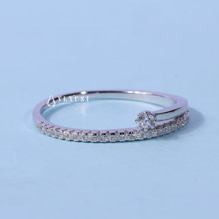 Shimmering round cluster moissanite wedding band angled view showing its sparkle