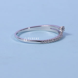 Shimmering round cluster moissanite wedding band close up of the setting