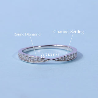 Refined round pave moissanite wedding band three quarter angled view