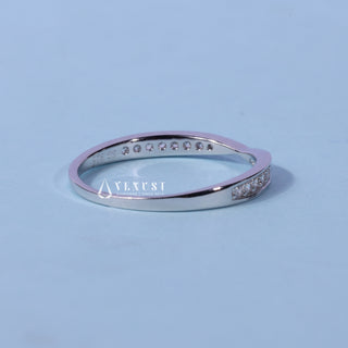 Refined round pave moissanite wedding band angled view showing its sparkle