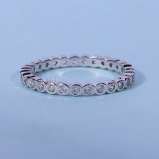 Chic round bezel moissanite wedding band front view