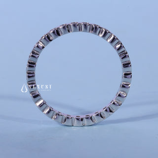 Chic round bezel moissanite wedding band angled view showing its sparkle