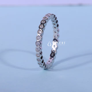 Chic round bezel moissanite wedding band side profile view