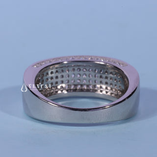 Delicate round pave moissanite wedding band side profile view