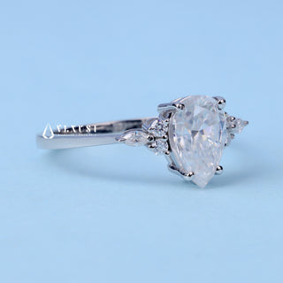 Radiant 1.0ct pear cluster moissanite ring angled view showing its sparkle