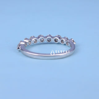 Delicate round half eternity moissanite wedding band top view