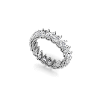 Lustrous pear eternity moissanite wedding band angled view showing its sparkle