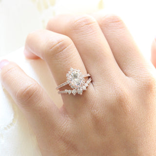 Gorgeous 1.50ct oval halo moissanite ring shown on a finger