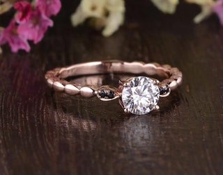 Lustrous 1.35ct round solitaire moissanite ring side profile view