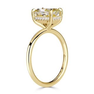 Yellow radiant solitaire moissanite engagement ring on hand