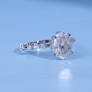 Bold 1.50ct oval pave moissanite ring angled view showing its sparkle