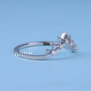 Modern round moissanite wedding band angled view showing its sparkle
