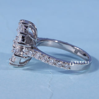 Front standing view of the Round Pear Moissanite Flower Cluster Engagement Ring showing the prong setting