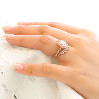 Graceful 1.50ct pear halo moissanite ring shown on a finger