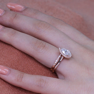 Lustrous 1.50ct pear halo moissanite ring side profile view