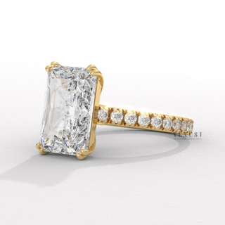 Front view of a radiant cut moissanite engagement ring with a pave band from a low angle