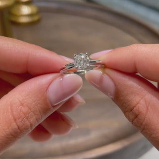 Sparkling 1.0ct round solitaire moissanite ring three quarter angled view