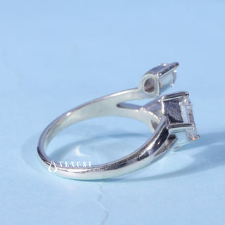 Angled view of the Three Stone Marquise Moissanite Emerald Cut Engagement Ring band and setting