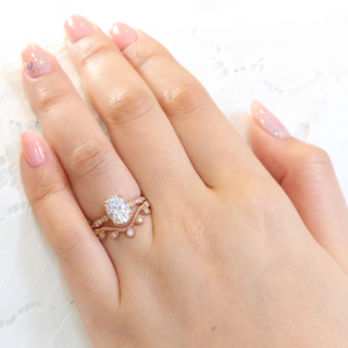 Elegant 2.0ct oval halo moissanite ring shown on a finger