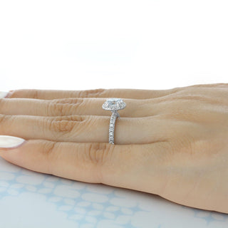 Vintage 1.0ct round halo moissanite ring shown on a finger