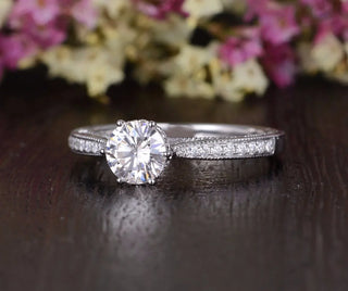 Gorgeous 1.35ct round solitaire moissanite ring shown on a finger