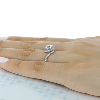 Bold 1.0ct round halo moissanite ring shown on a finger