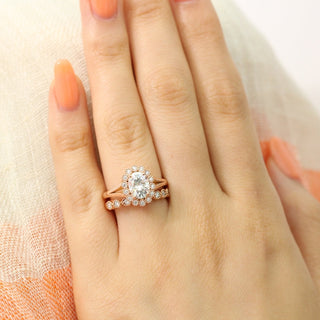 Shimmering 1.50ct oval halo moissanite ring shown on a finger