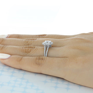 Modern 1.0ct round halo moissanite ring shown on a finger