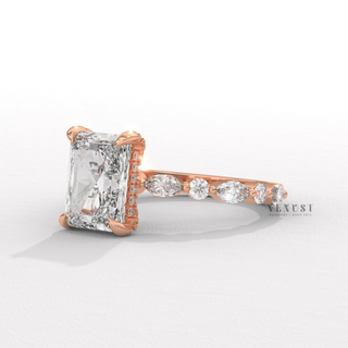 Front view of a round cut moissanite engagement ring with a hidden halo and pave band with the band in focus