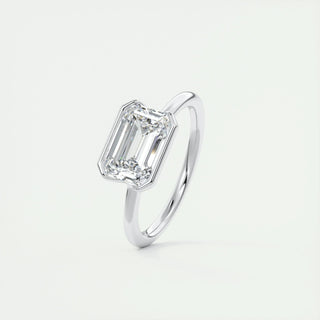 Sparkling 1.91ct emerald solitaire moissanite ring shown on a finger
