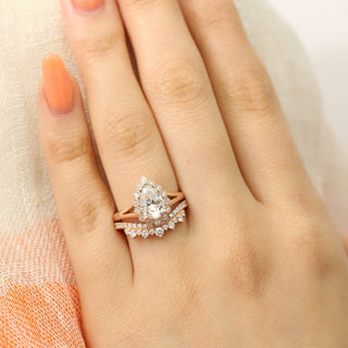 Chic 1.60ct pear halo moissanite ring shown on a finger