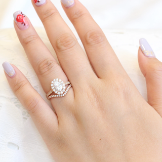 Stunning 1.50ct oval halo moissanite ring shown on a finger