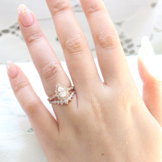 Refined 1.0ct pear halo moissanite ring close up of the setting