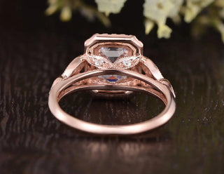 Modern 1.0ct emerald halo moissanite ring shown on a finger