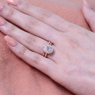 Lustrous 1.50ct pear halo moissanite ring overhead view